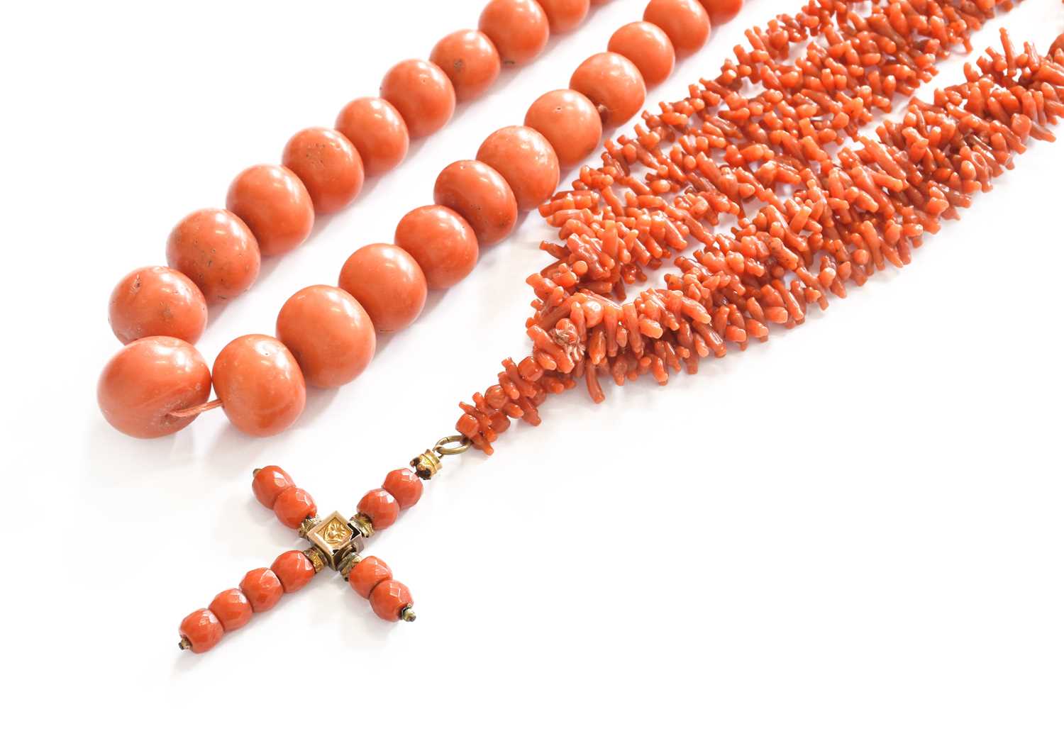 A Graduated Coral Bead Necklace, length 42cm; and A Four Strand Coral Branch Necklace, with cross