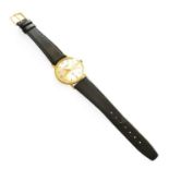 An 18 Carat Gold Wristwatch, signed Slogan Case diameter - 33 mm (without the winding crown)