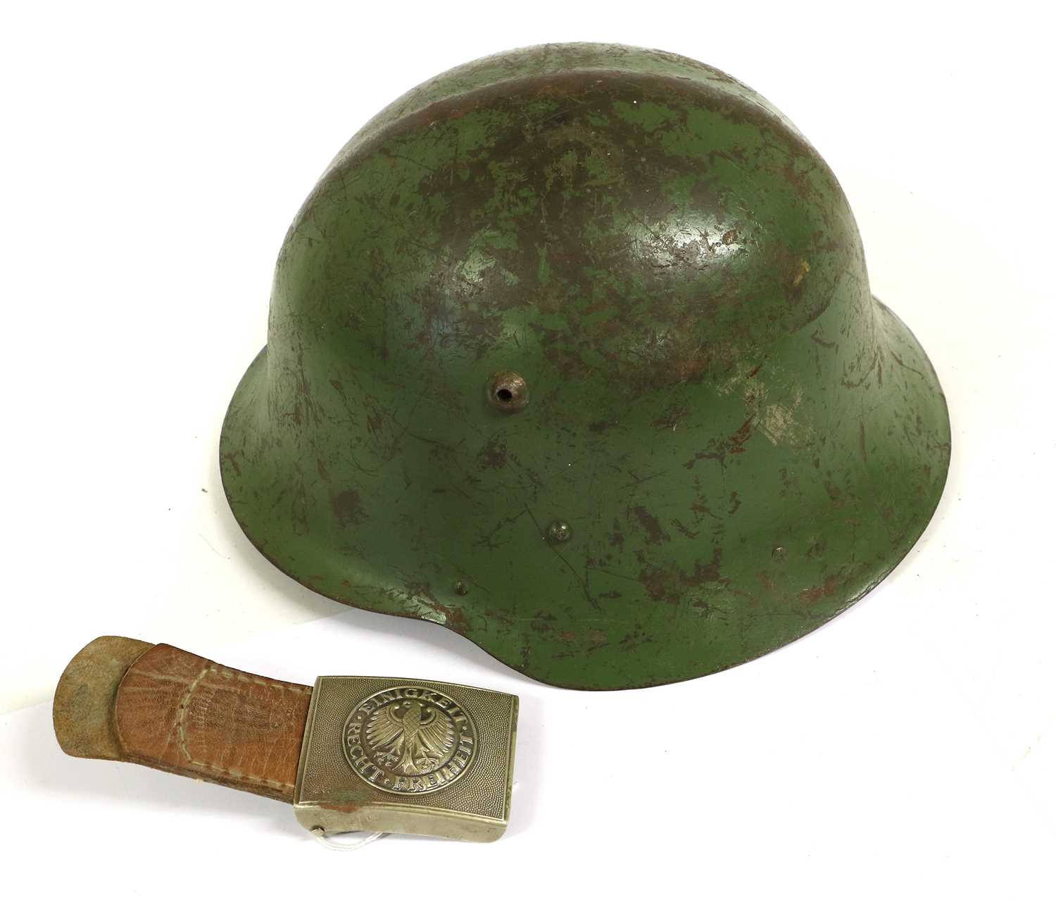 A Bulgarian M36 Type C Combat Helmet, with green paint and remnants of shield decal, the leather