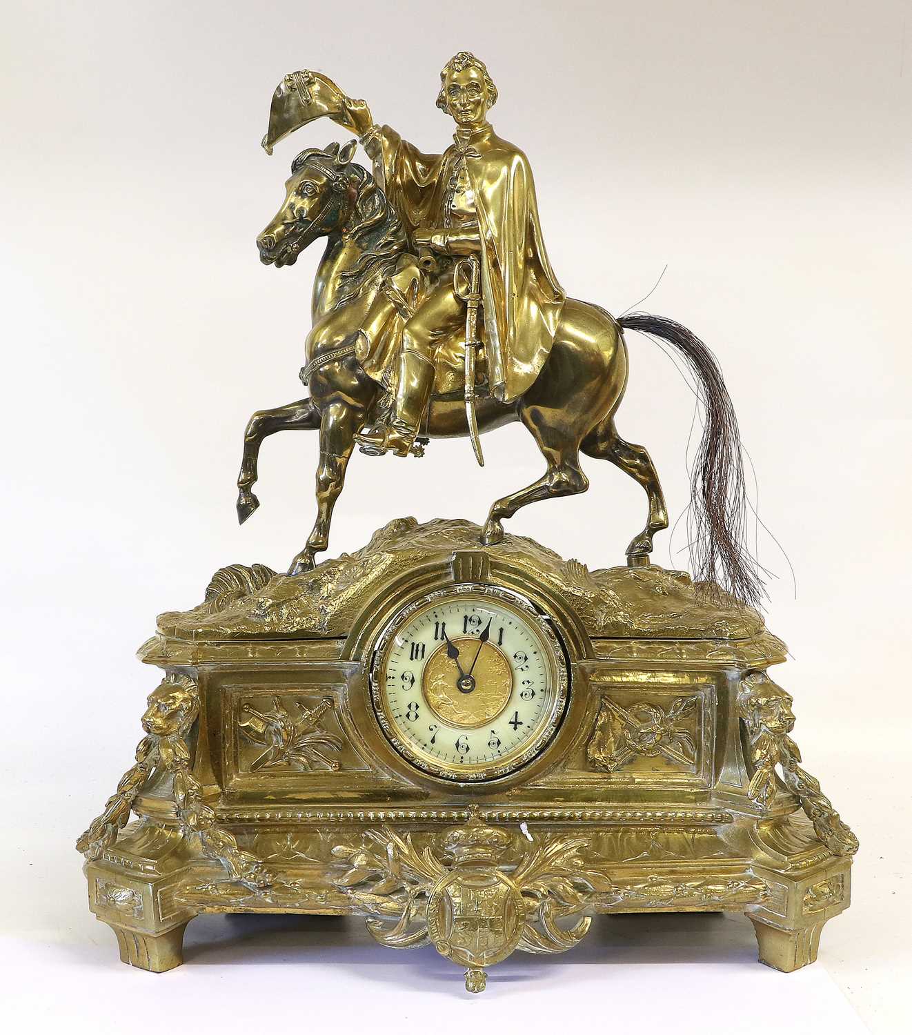 A 19th Century Brass Mantel Clock, the white enamel chapter ring with black arabic numerals, with