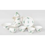 A Herand Porcelain Teaset, comprising, three cups, four saucers, milk jug, cream and sugar