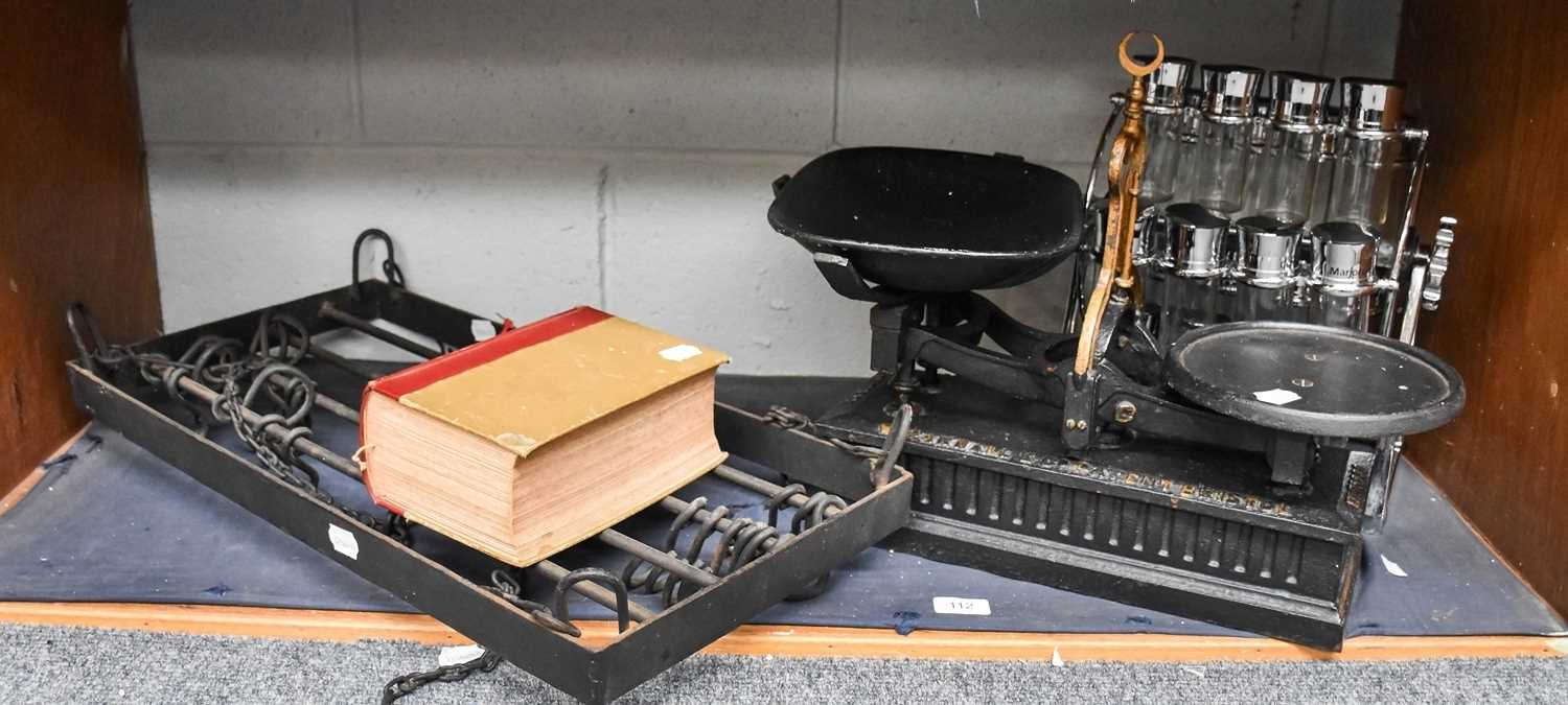 A Set of Cast Iron Weighing Scales by Parnall, a chrome condiment set and stand, an iron pan rail