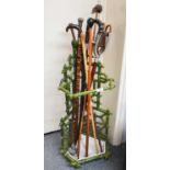 A Reproduction Green Painted Cast Metal Stick Stand, in the form of bamboo trelice, together with