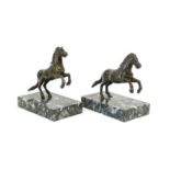 After Pietro Tacca (1577-1640): A Pair of Bronze Leaping Horses, on rectangular marble bases 17cm