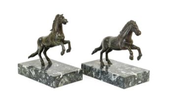 After Pietro Tacca (1577-1640): A Pair of Bronze Leaping Horses, on rectangular marble bases 17cm