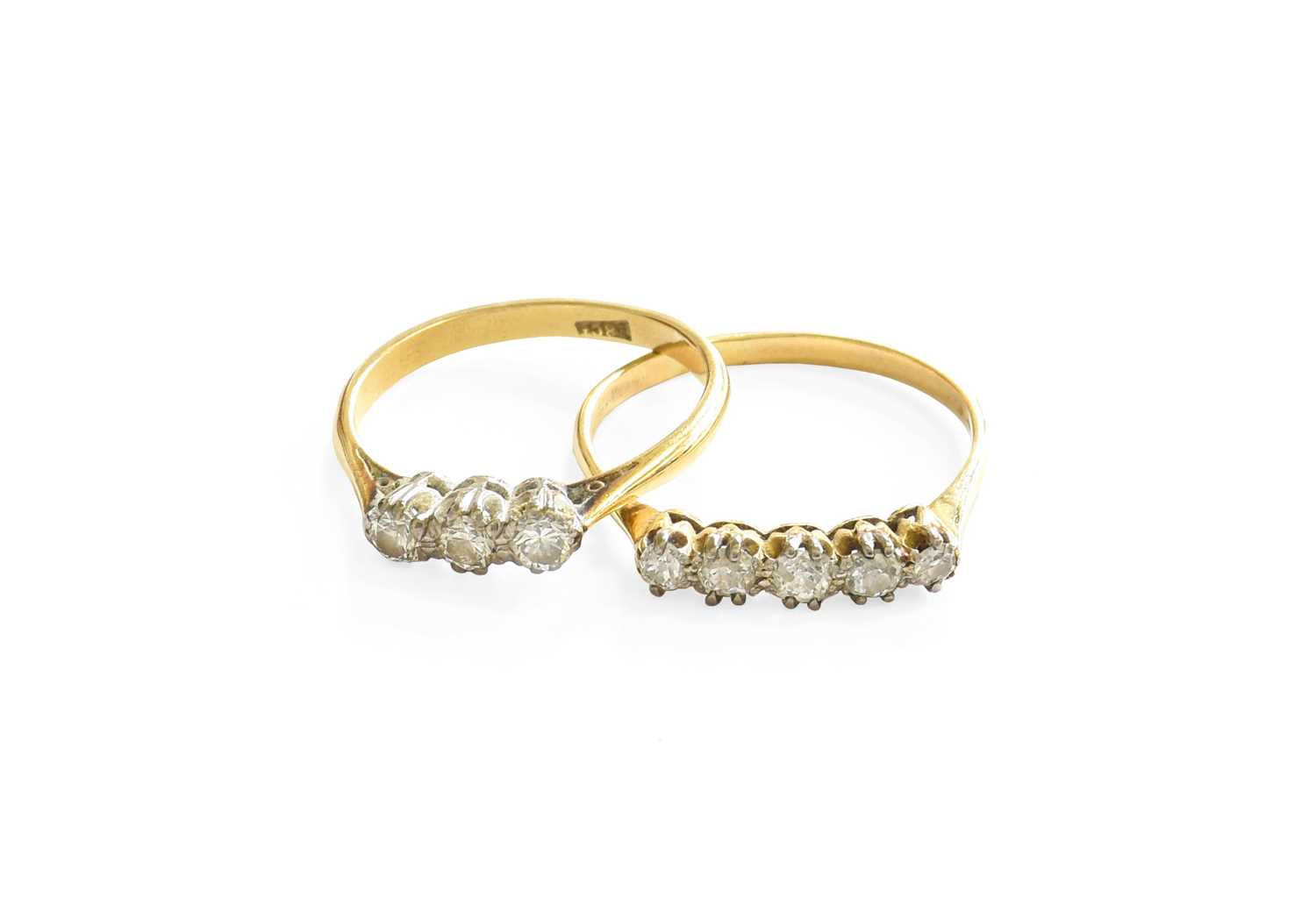 A Diamond Five Stone Ring, the old cut diamonds in white double claw settings, to a yellow tapered