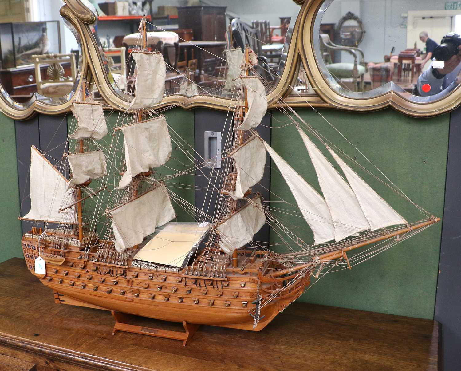 A 20th Century Model of HMS Victory in Full Sail, on stand, 75cm high with explanatory card (a.f.)