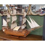 A 20th Century Model of HMS Victory in Full Sail, on stand, 75cm high with explanatory card (a.f.)