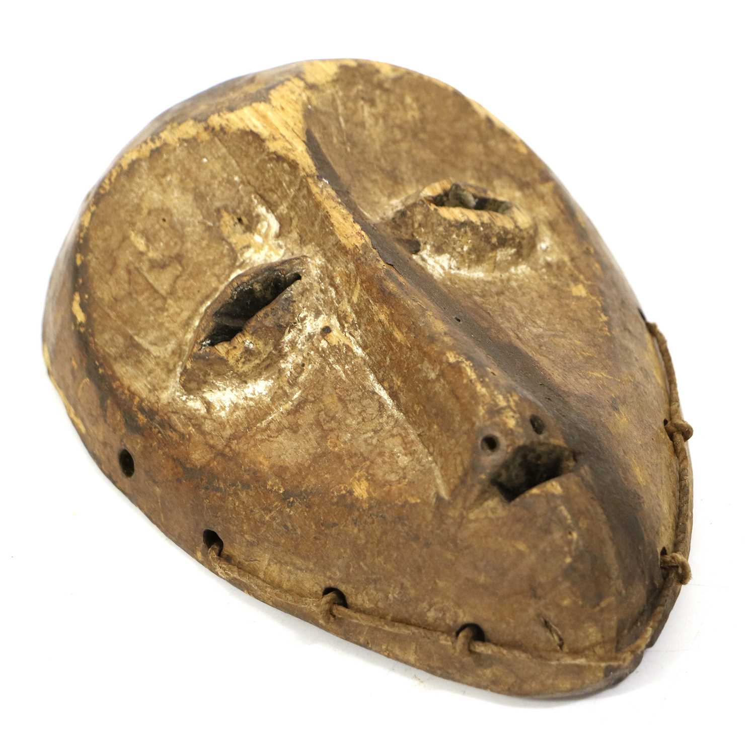 A Dan Small Carved Wood Mask, Ivory Coast, with heart shape face, pierced swollen eyelids, long nose - Image 6 of 6