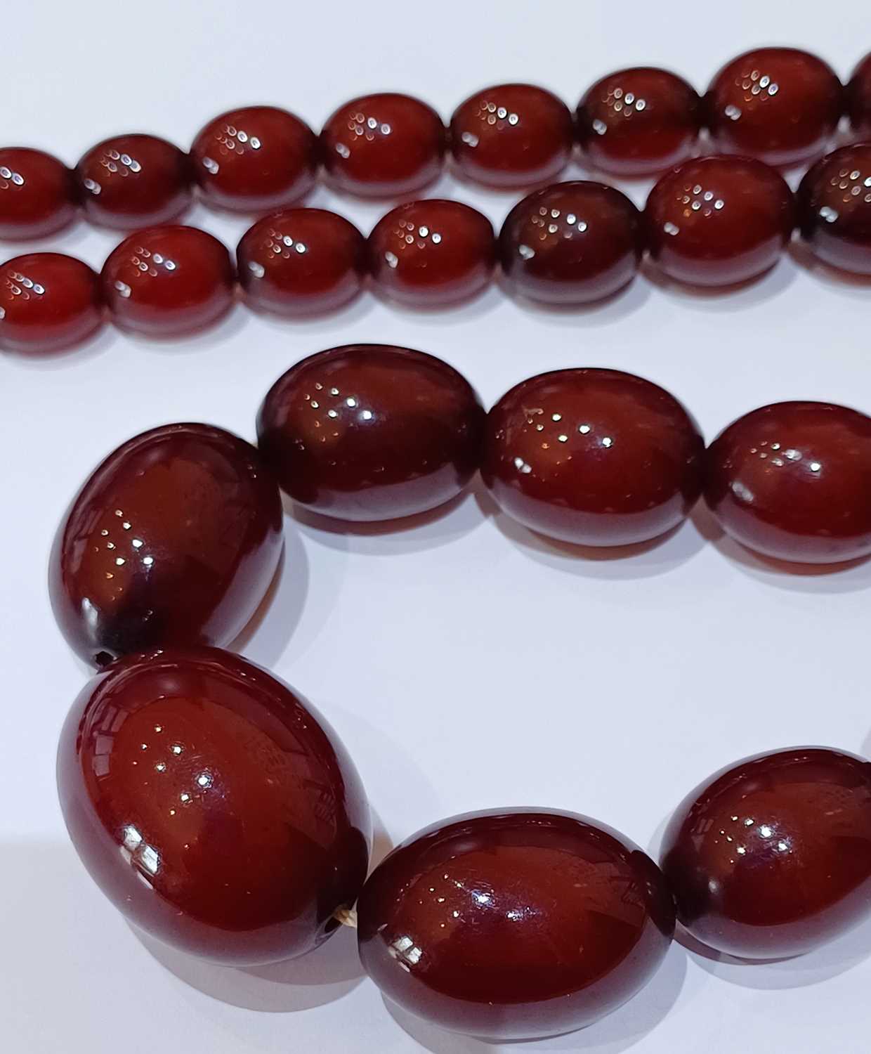 A Bakelite Bead Necklace, comprising of graduated beads, length 69.3cm Gross weight 90.8 grams. - Image 7 of 9