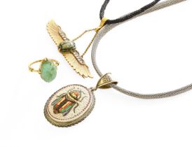 A Winged Scarab and Diamond Brooch/Pendant, on a corded necklace, measures 6.2cm by 5.1cm; A