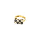 An 18 Carat Gold Sapphire and Diamond Ring, formed of two rows of alternating round brilliant cut