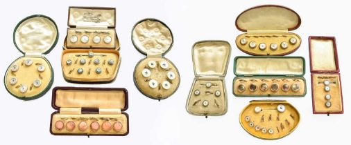 Ten Button Suites, of varying designs, each cased One set stamped '9CT' - 4.8 grams.