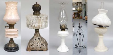 A 19th Century Brass Oil Lamp, on wrought iron stand, together with four other various examples