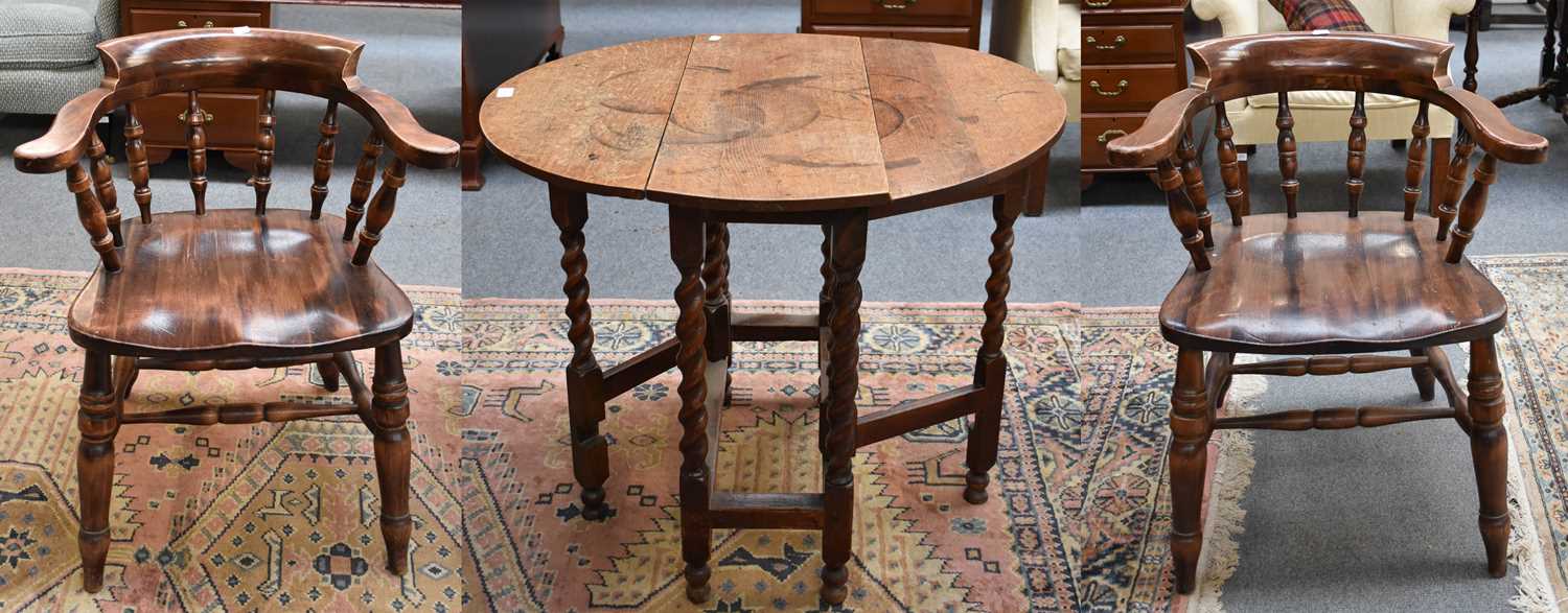 A Pair of Smokers Bow Armchairs; together with a small oak gateleg table, 80cm by 69cm by 67cm (3)