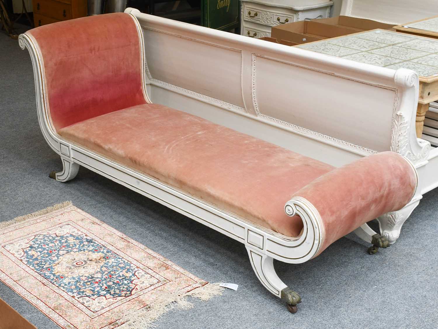 A Large Parcel Gilt White Painted Victorian Day Bed, with scroll ends, the legs capped with brass