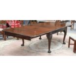 A Victorian Extending Dining Table, with three additional leaves, on ball and claw feet, 305cm by