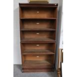 A Five Tier Oak Globe Wernicke Bookcase, 87cm by 31cm by 176cm (no glass doors)