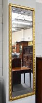 A Gilt Framed Hall Mirror, 136cm by 43cm