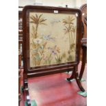 A Mahogany Fire Screen Table, with a silk work panel depicting birds, insects and foliage, 57cm by