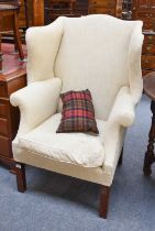 A George III Mahogany Framed Wingchair, with cream upholstery General wear and slight discolouration