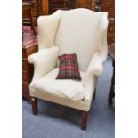 A George III Mahogany Framed Wingchair, with cream upholstery General wear and slight discolouration