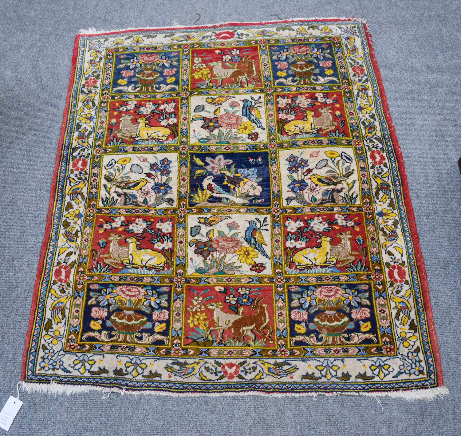 Lillian Rug, the blood red field with central flowerhead enclosed by rosette borders, 184cm by 80cm, - Image 2 of 4