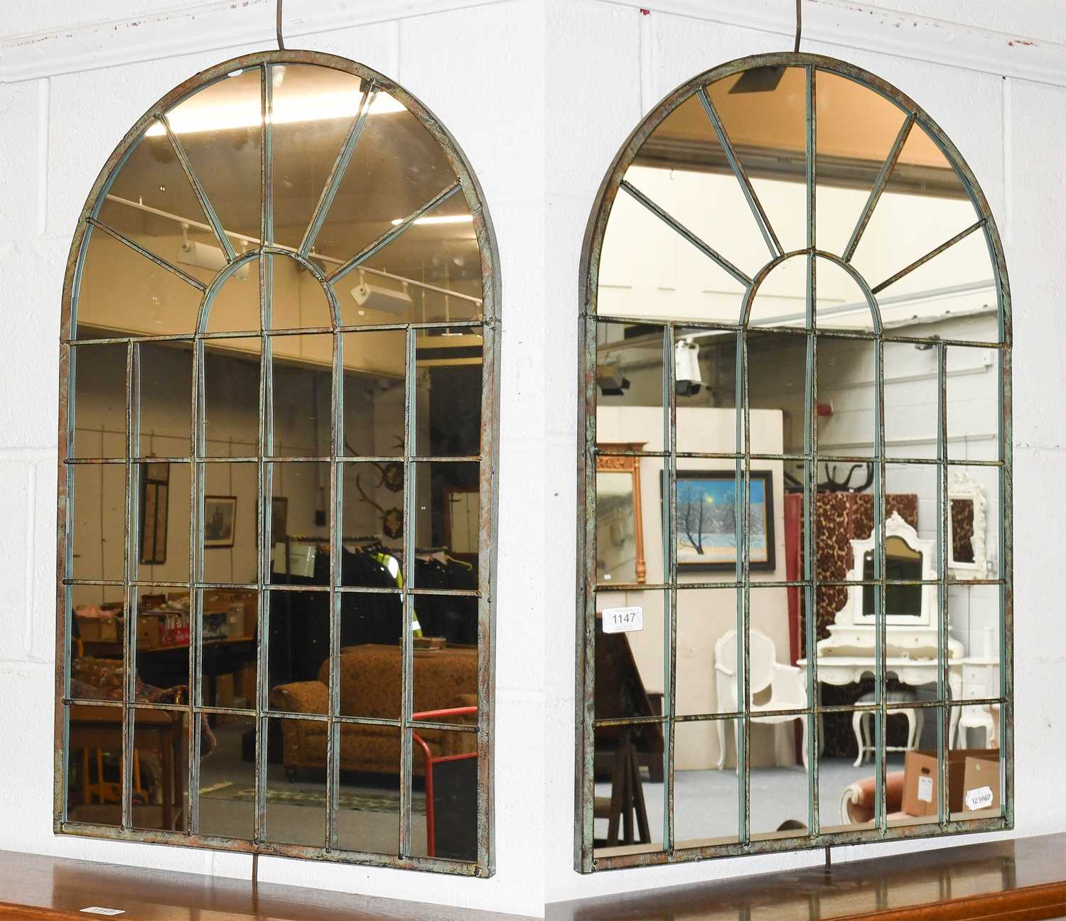 A Pair of Arch Mirrors, in the form of windows with verdigris patinated metal work Dimensions - 77cm