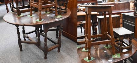 An 18th Century Oak Gateleg Table, 118cm by 97cm by 71cm; together with two oak stools