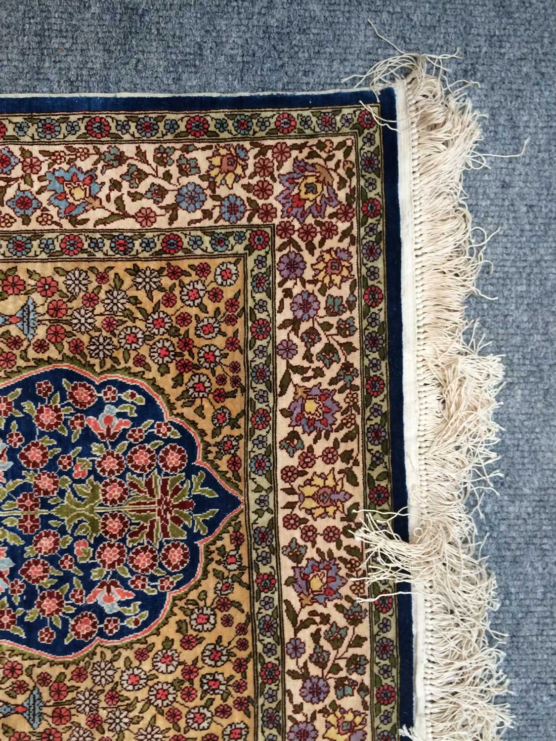 A Hereke Silk Rug, the indigo field of flowering plants, framed by mustard spandrels and ivory - Image 13 of 14