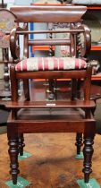 A 19th Century Child's Mahogany High Chair, with scroll arms, drop in seat, raised on plinth base,