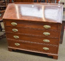 A George III Mahogany Bureau, with fall flap, opening to reveal fitted interior, four graduated