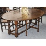 A 19th Century Oak Wake Table, on turned and block supports, 214cm by 150cm by 75cm