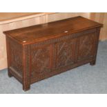 A Early 20th Century Carved Oak Coffer, the top dated 1914 and initialed IWH, 122cm by 45cm by 61cm