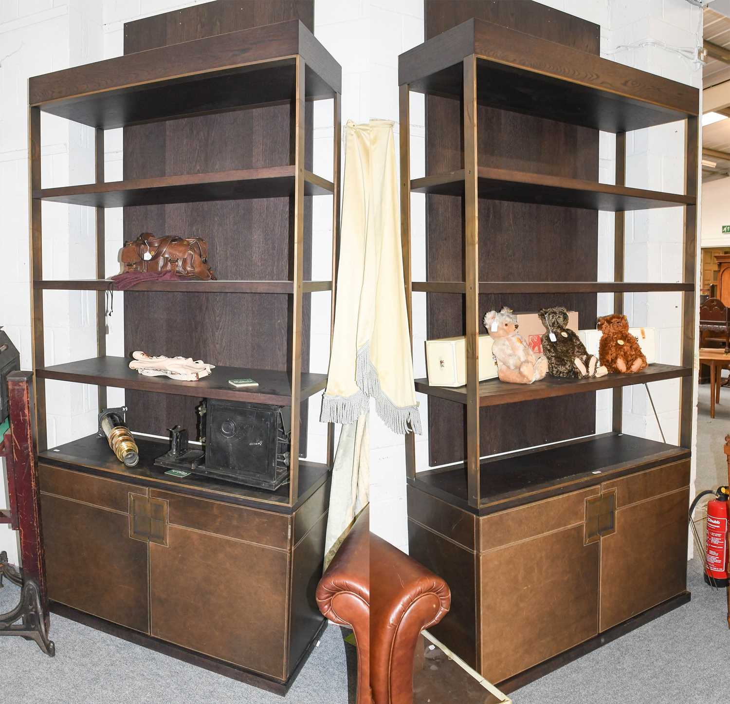 A Pair of Substantial Stained Wood Brushed Metal and Brown Leather Bookcases, the four open tiers