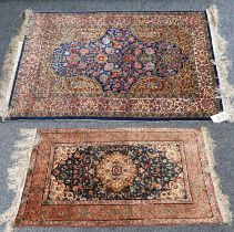 A Hereke Silk Rug, the indigo field of flowering plants, framed by mustard spandrels and ivory