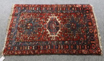 Karajah Rug, the deep madder field with three geometric medallions enclosed by triple narrow