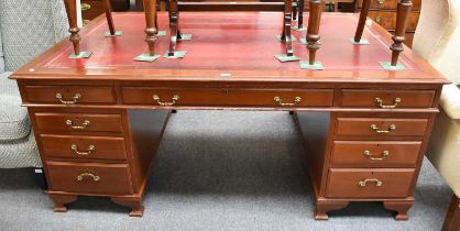 A Mahogany Leather Inset Partners Desk, bearing label for W. Richardson ltd, The Headrow Leeds,