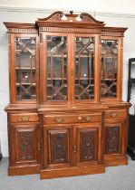 A Late Victorian Mahogany Breakfront Glazed Bookcase, the upper section glazed with bevelled