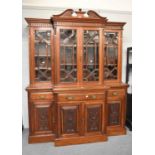 A Late Victorian Mahogany Breakfront Glazed Bookcase, the upper section glazed with bevelled