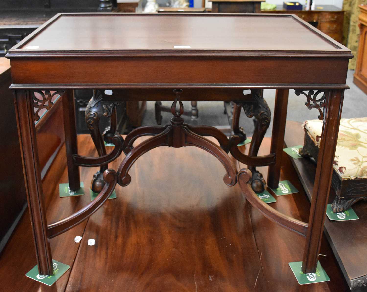 A Reproduction Mahogany Silver Table, with pierced spandrals and shaped stretchers, 81cm by 53cm