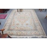 Kashan Design Carpet, the cream field of vines centred by a medallion, framed by spandrels and