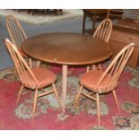 An Ercol Light Elm Drop Leaf Table, 124cm by 112cm by 71cm; together with a set of four matching