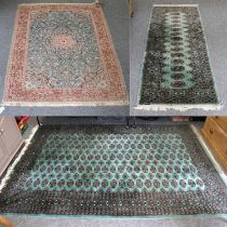 A Kasmir Silk Piled Rug, the sky blue field with central medallion, framed by spandrels and coral