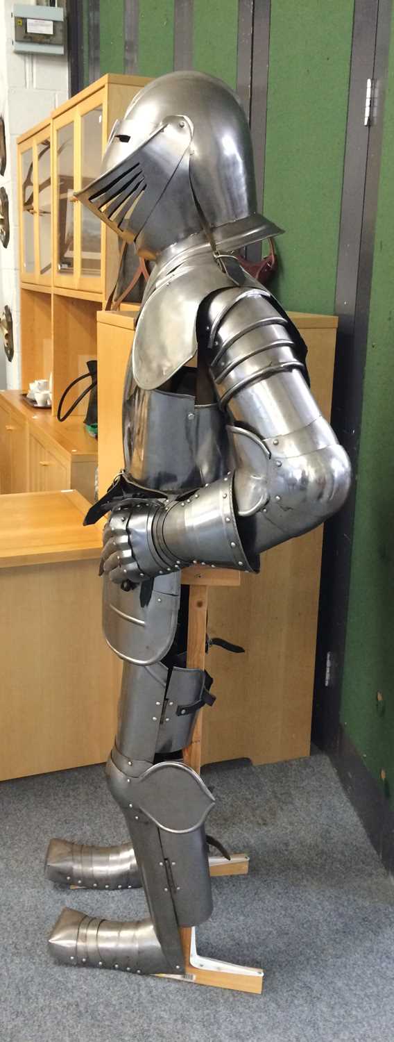 A Modern Reproduction Polished Steel Complete Suit of Armour, on wooden stand 173cm high on its - Image 2 of 4