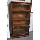 An Oak Globe Wernicke Four Tier Stacking Bookcase, three tiers labelled Globe Wernicke, one tier