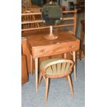 A Ercol Light Elm Dressing table, with single drawer, on splay supports with turned stretchers. 69cm