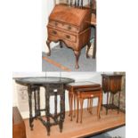 A 20th Century Walnut Bureau, an oak drop leaf table, a nest of reproduction burr walnut tables