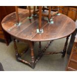 A 17th Century Gateleg Table, oval top, twin drop leaves, baluster turned legs and stretchers with