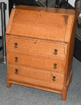 A 20th Century Oak Bureau, 73cm by 43cm by 97cm; together with a gilt framed rectangular mirror with